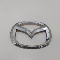 Эмблема на крышку багажника Mazda Mazda 2 (DE) (2007 - 2014) D65151730