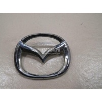 Эмблема на крышку багажника Mazda 323 (BJ) (1998 - 2003) B25D51730B