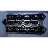 Головка блока цилиндров двигателя (ГБЦ) Opel Astra F 1997 90400186