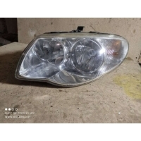 Фара левая Chrysler Voyager 4 2006 04857831AC
