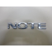Эмблема на крышку багажника Nissan Note (E11) (2006 - 2013) 908929U000