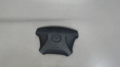 NC1057K00B00 Подушка безопасности водителя Mazda 323 (BJ) 1998-2003 1999