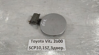 7735052010 Лючок топливного бака Toyota Vitz SCP10 2000 77350-52010