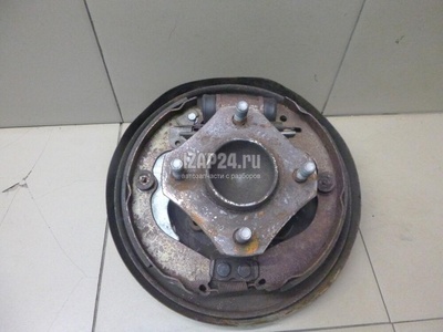 44000JX00A Щит опорный задний правый Nissan NV200 (M20) 2009