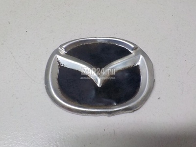 L323102D9 Эмблема Mazda MPV II (LW) (1999 - 2006)