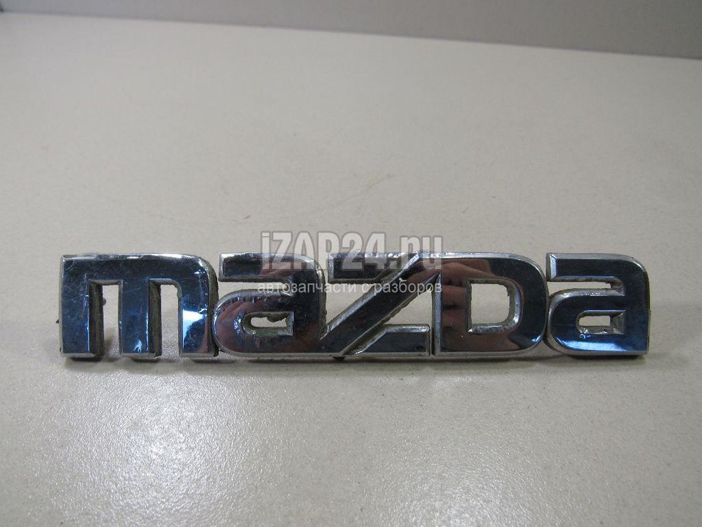 BP4K51710A Эмблема Mazda Mazda 3 (BK) (2002 - 2009) купить бу Z6413173 -  iZAP24